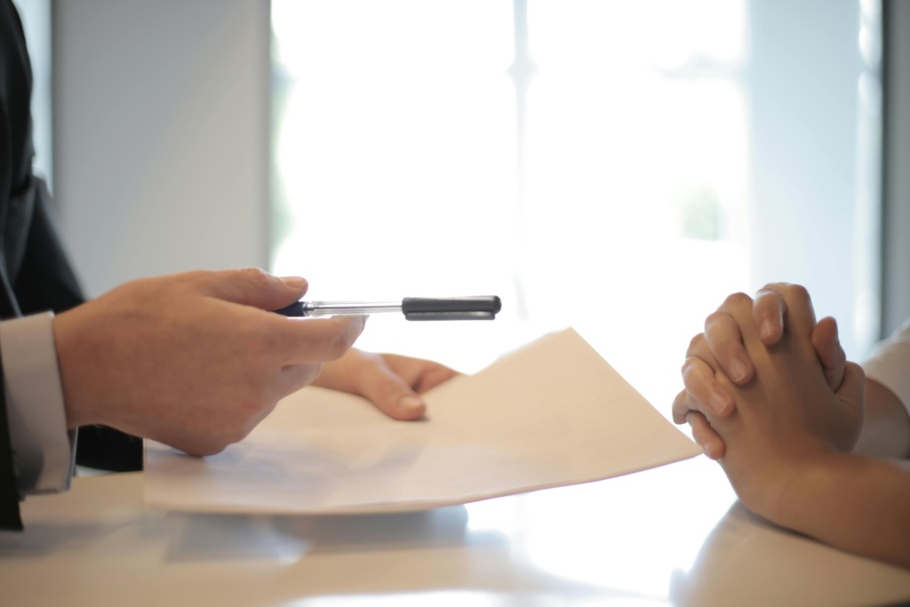 Lawyer Giving Contract To A Woman To Sign
