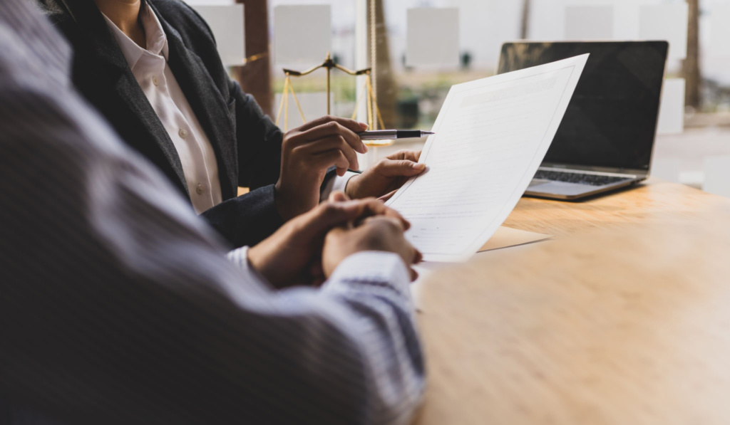 Man Injured At Work Discussing Claim With Lawyer