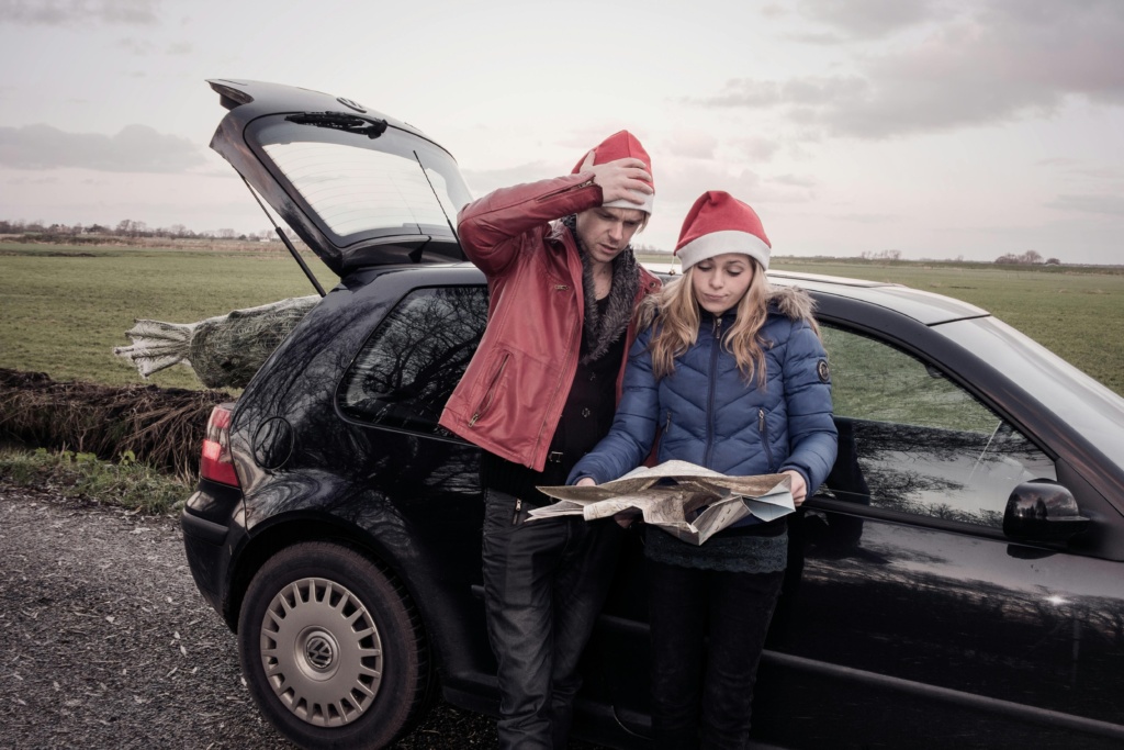 Couple Doing A Christmas Roadtrip